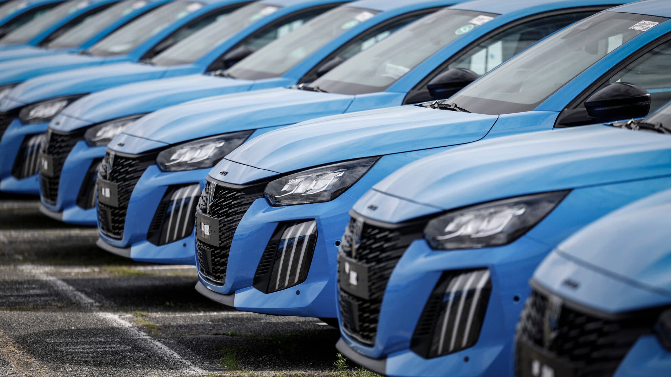 Peugeot cars are seen parked outside the Stellantis multinational car manufacturer's plant in Poissy, west of Paris, on April 15, 2026. Automaker Stellantis will cease automobile production at its historic Poissy plant (Yvelines) after 2028. The site will be converted into a parts manufacturing and vehicle dismantling center, retaining 1,000 of the current 2,000 jobs, the group announced on April 16, 2026.