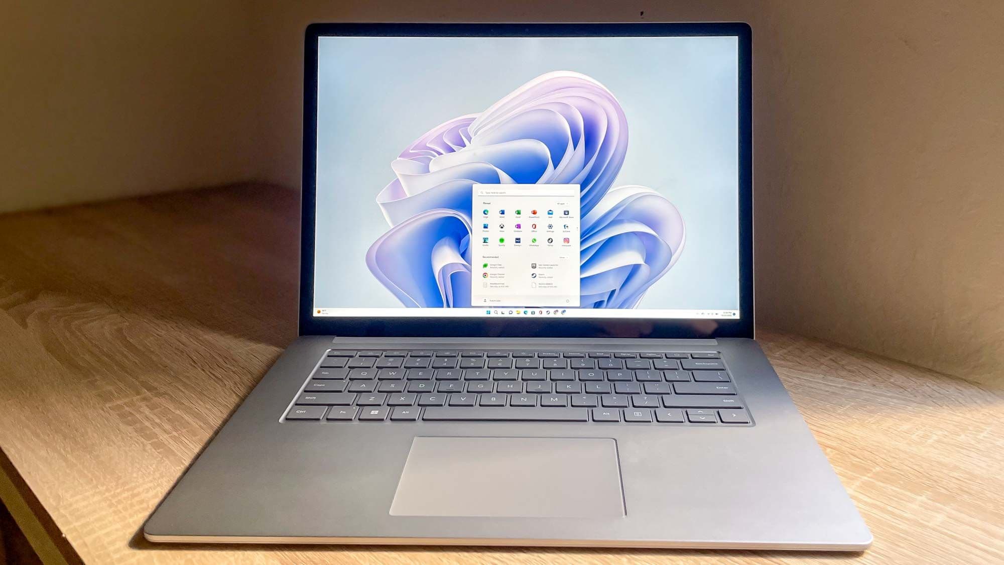 Surface Laptop 5 open on desk (via tomsguide.com)