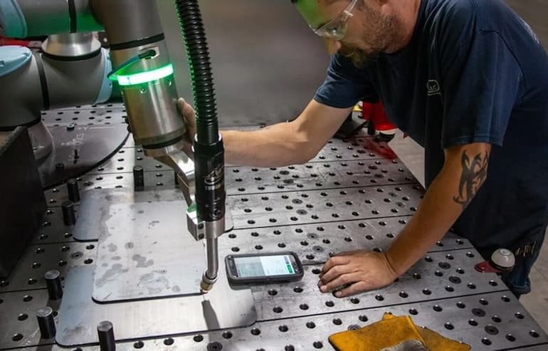 Force- and power-limited robots such as those from UR enable humans to work alongside robots for tasks such as welding, shown here.