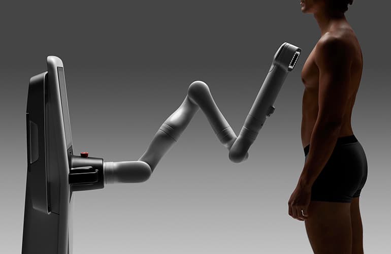 robot inspects skin of a male patient.