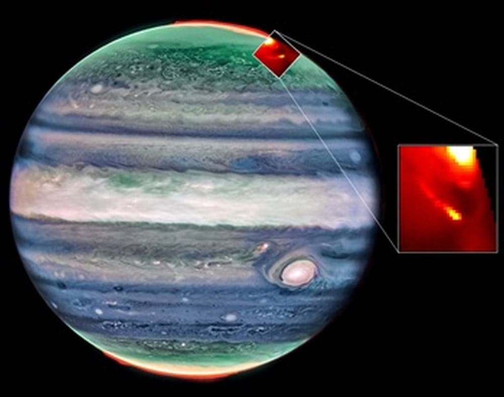 This image shows the two auroral footprints in Jupiter's aurora borealis created by the moons Io and Europa. The JWST observed these footprints and provided the first spectral measurements. These showed extreme temperature and densities in Io's footprint, a big surprise to the researchers behind the work. Image Credits: Webb/NIRCam Credit: NASA, ESA, CSA, Jupiter ERS Team; image processing by Judy Schmidt. Webb/NIRSpec Credit: Katie L. Knowles (Northumbria University).