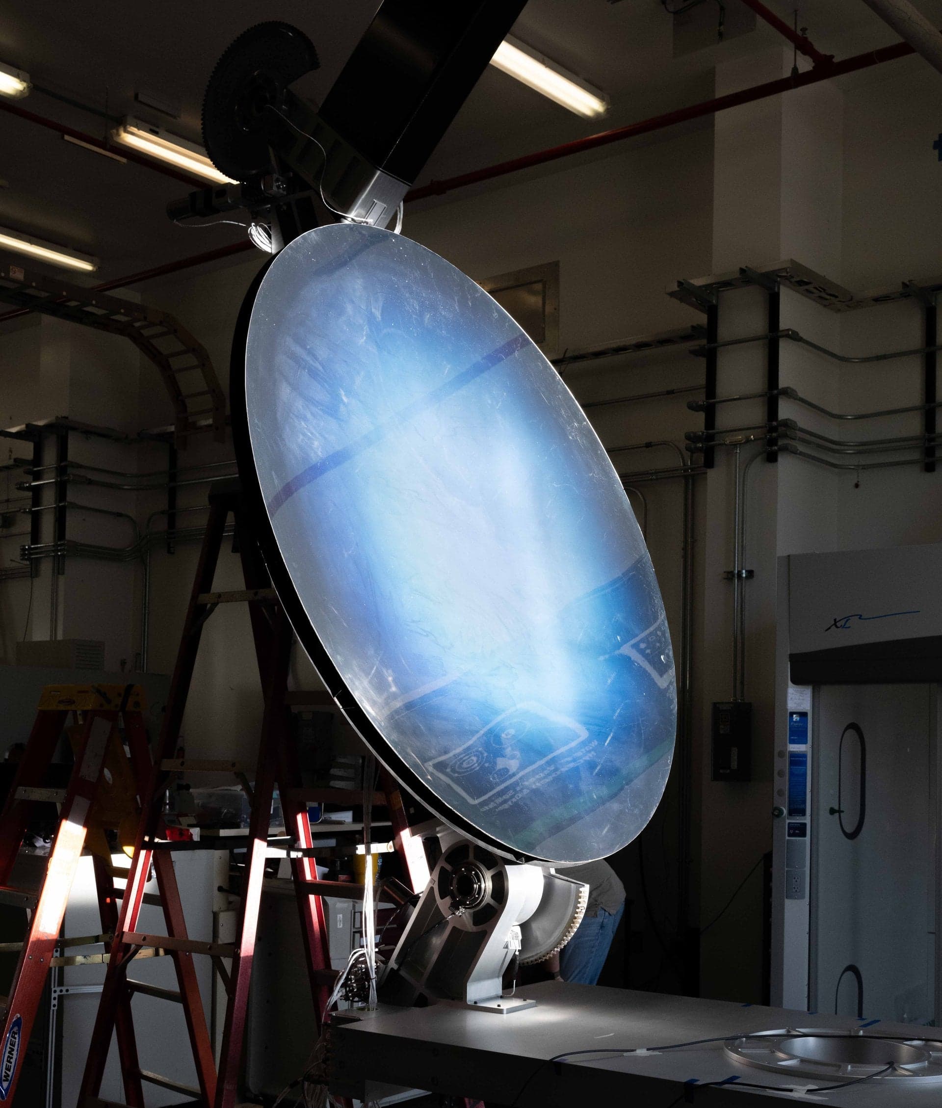 A solar concentrator is tested as part of the Carbothermal Reduction Demonstration (CaRD) project, which aims to produce oxygen from simulated lunar regolith for use at the Moon’s south pole. Credit: NASA/Michael Rushing
