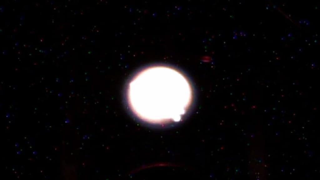 Image of a spherical flame in an experiment onboard the ISS. Credit - Science@NASA / Goddard Space Flight Center