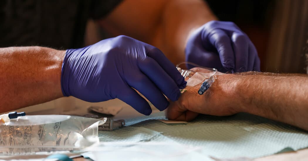A clinical trial participant receiving an infusion of an anti-amyloid Alzheimer’s drug in New York last year. (via nytimes.com)