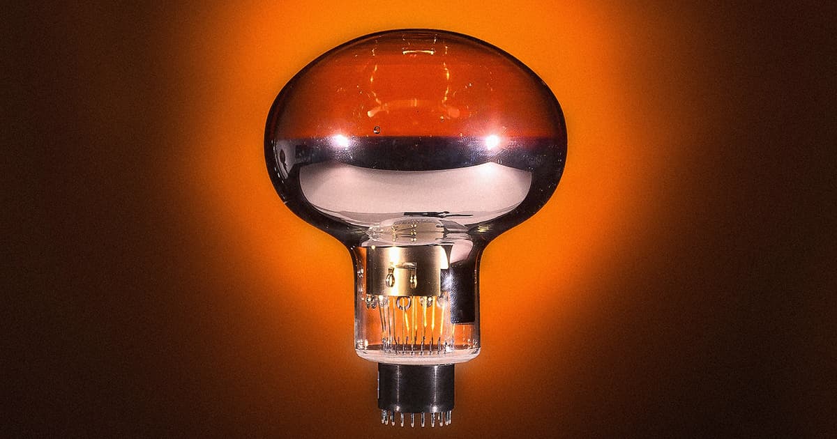 A metallic photomultiplier tube that looks like a large light bulb.